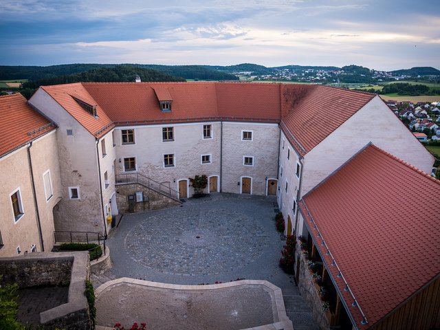 Romantik Hotel Hirschen: picture gallery Courtyard of a historic building with red tile roofs and surrounding landscape view