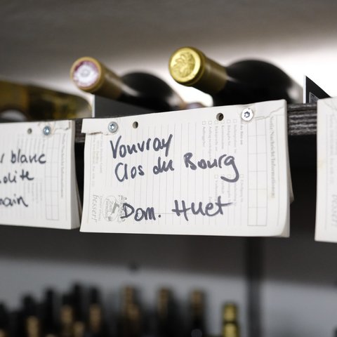 Fine Dining & Gourmet Cuisine in the Upper Palatinate Wine bottles with handwritten labels on a wine rack