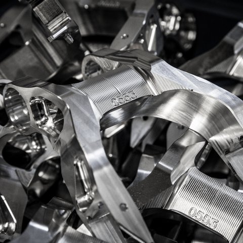 Looking for a hotel with bike rental in Bavaria? Close-up of polished metal machine parts with engraved number