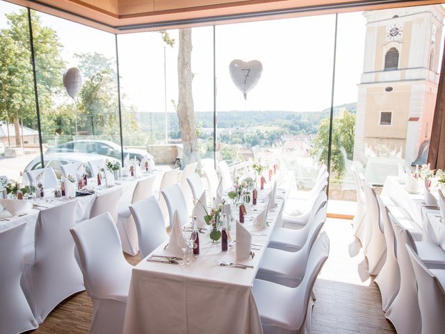 Romantik Hotel Hirschen: picture gallery Bright room with set tables and white chairs for a celebration
