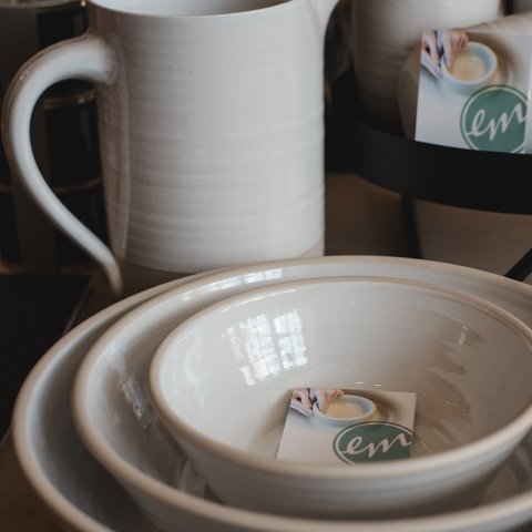 Eco-friendly hotel in Germany with Hirschenmanufaktur Various white ceramic dishes stacked on a table