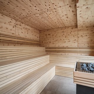 The most beautiful bathing lakes in Oberpfalz Modern sauna interior with wooden paneling and sauna heater