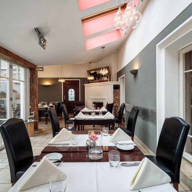 Home Elegant restaurant with set tables and modern interior design