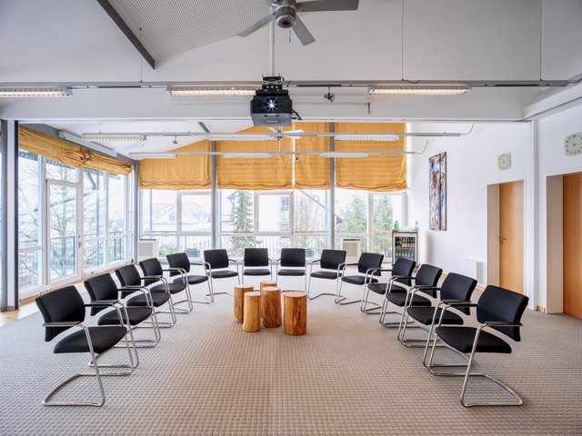 Romantik Hotel Hirschen: picture gallery Empty conference room with chairs in a circle and wooden stools in the center