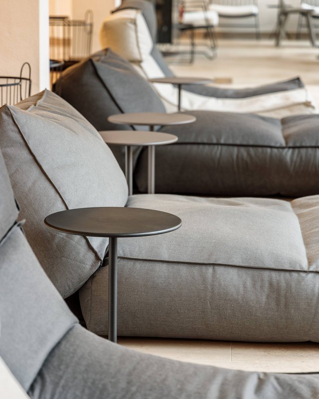 Hotel in Upper Palatinate: Get a breath of holiday air! Several gray sofas with small round side tables in a room