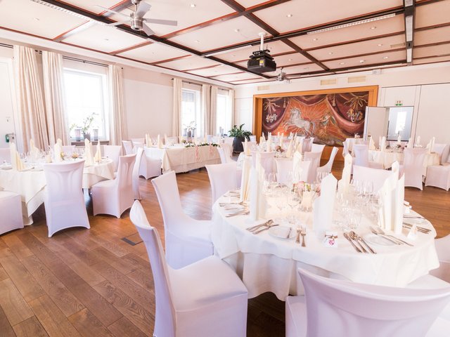 Romantik Hotel Hirschen: picture gallery Elegantly set tables in a bright banquet hall with wooden flooring