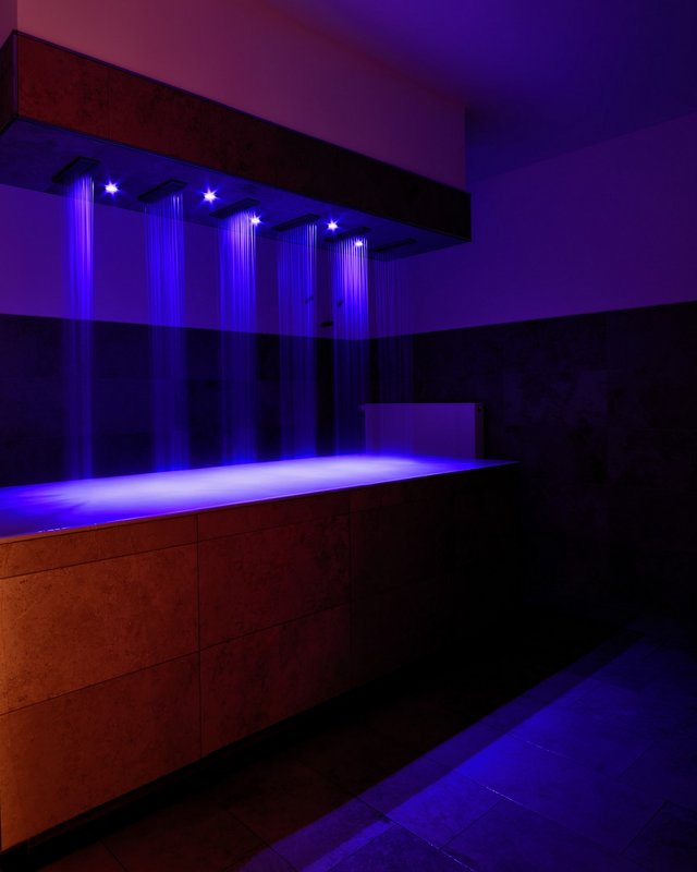 Romantik Hotel Hirschen: Breakfast Modern shower with blue illuminated water jets above bathtub