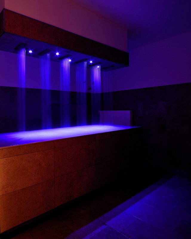 Romantik Hotel Hirschen: Breakfast Modern shower with blue illuminated water jets above bathtub