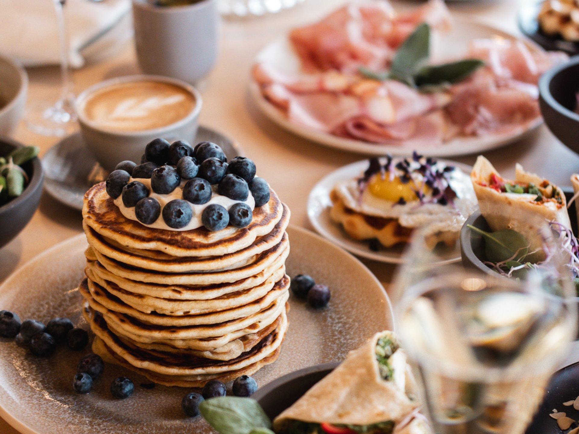 Events & Culinary Experiences in Parsberg Table with pancakes, wraps, coffee, and other breakfast dishes
