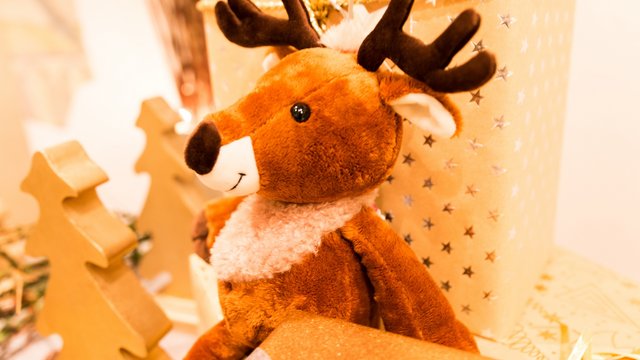 Looking for holiday accommodation in Upper Palatinate? Christmas plush reindeer with presents and decorations in the background