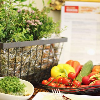 Revel in anticipation Fresh herbs and vegetables like peppers, tomatoes, cucumber and radishes in baskets