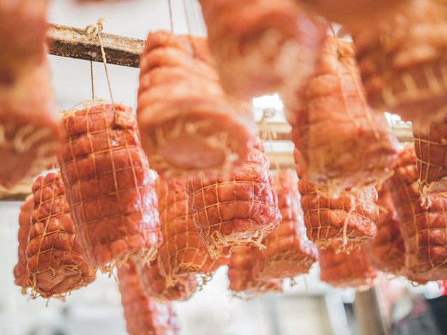 Beer Garden in Parsberg: Regional Cuisine & Cold Beer Rolled cured meat hanging in a butcher shop