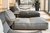 Wellness Large modern gray floor cushions with small side tables in a bright room