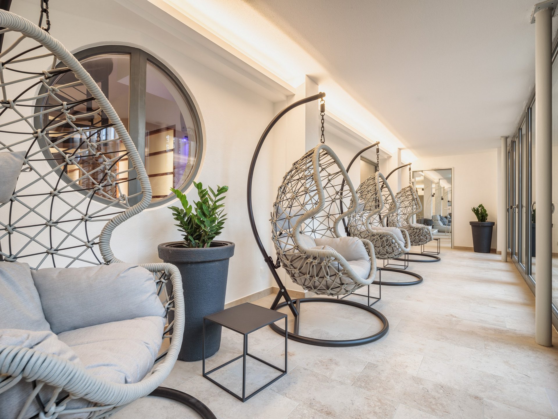 Garden, Relaxation Rooms & Favorite Spots Modern hanging chairs in bright minimalist interior with plants and a mirror