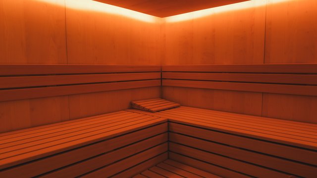 Weihnachtsmärkte Innenraum einer holzverkleideten Sauna mit warmem Licht