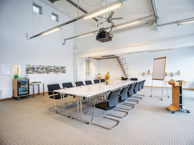 Romantik Hotel Hirschen: picture gallery Bright modern conference room with table, chairs, and presentation area