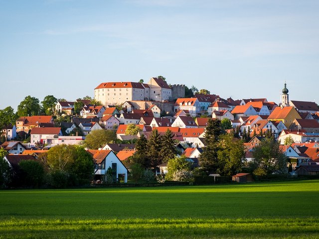Romantik Hotel Hirschen: picture gallery View of a village with castle and red roofs in sunlight