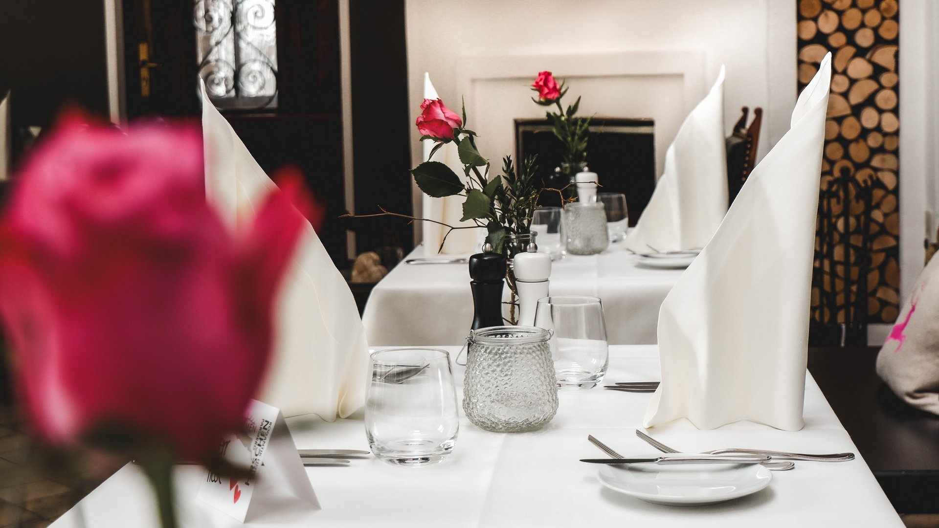 Valentine's Day 2026 Elegantly set table with white napkins and red roses