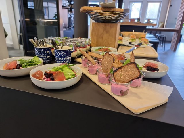 Romantik Hotel Hirschen: picture gallery Assorted appetizers and sandwiches on a set table in a restaurant