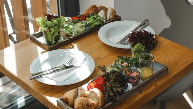 Day wellness in Upper Palatinate Table set for two with bread, salad, and sauces in jars