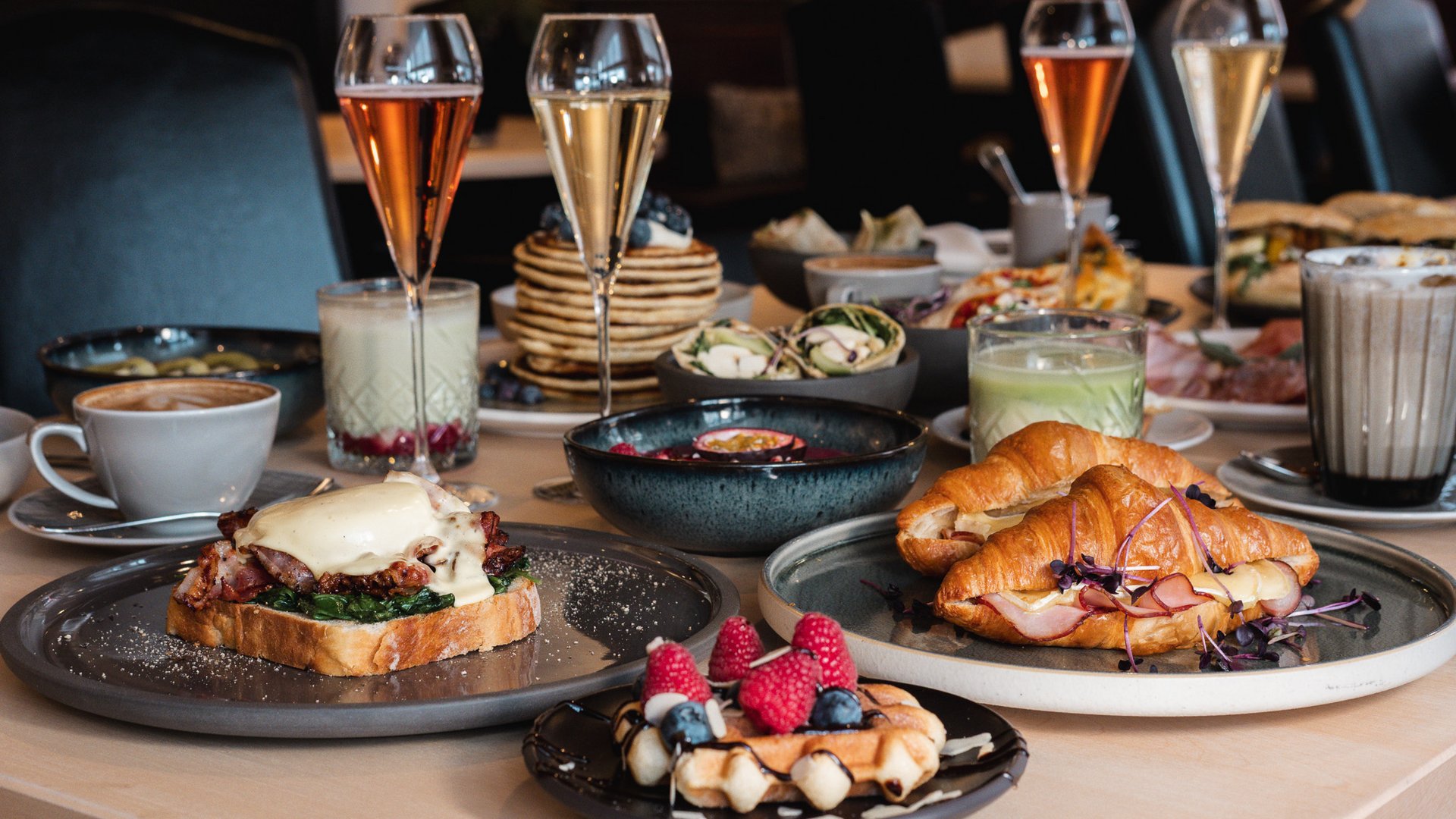 Brunch – breakfast for late risers Assorted breakfast dishes and drinks arranged on a table