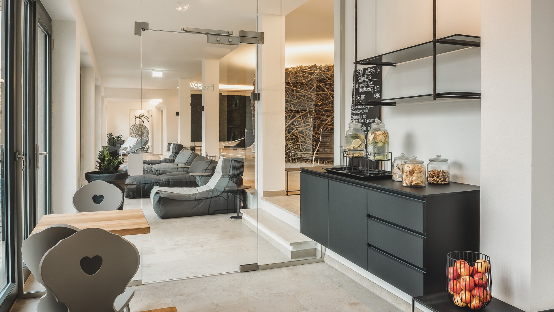 Wellness Modern lounge area with glass wall, bean bags, and snack bar