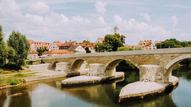 Hotel in Upper Palatinate: Get a breath of holiday air! Stone bridge over calm river in a German town on a sunny day