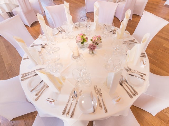 Romantik Hotel Hirschen: picture gallery Round table set with white chairs, flowers, napkins, and glassware